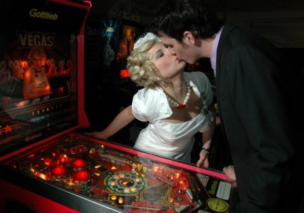 Playing pinball, shortly after our wedding